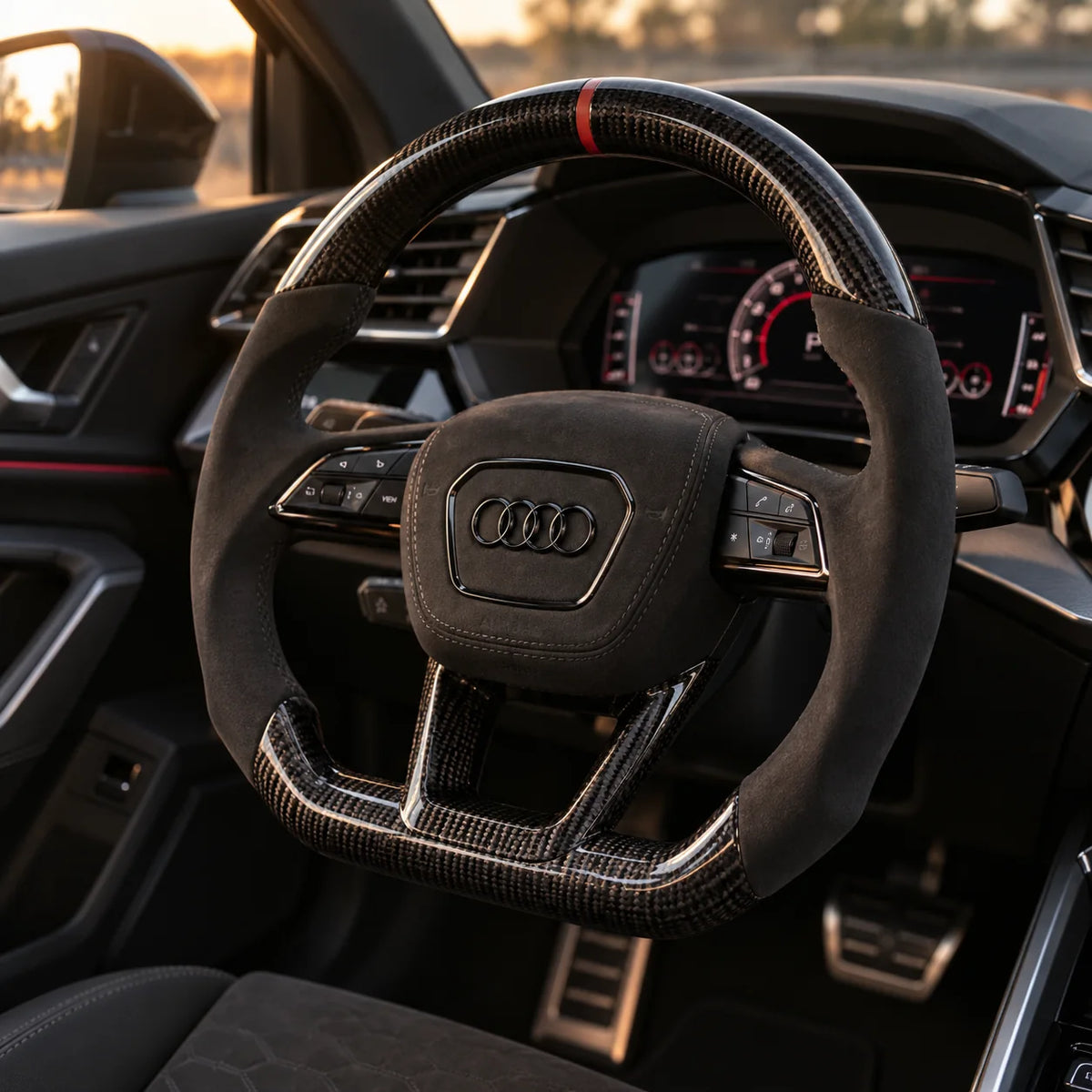 Audi A3 8Y : volant monté vu depuis le siège passager, bas plat et carbone brillant